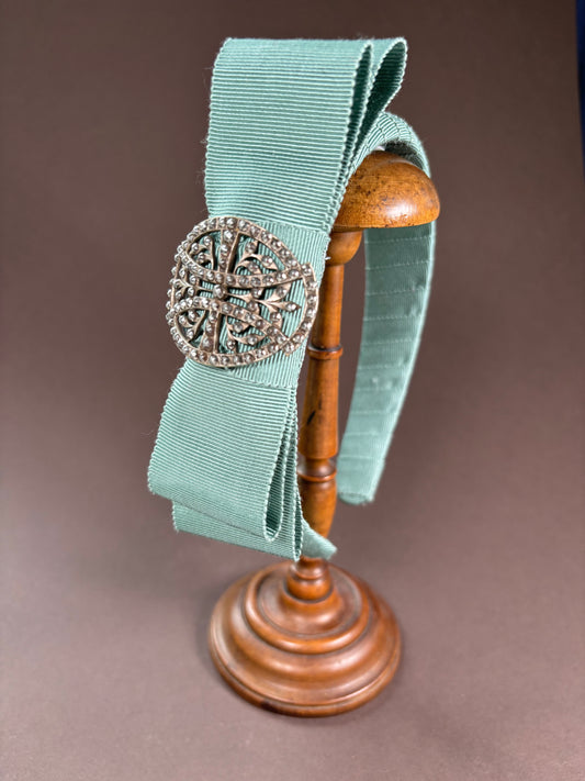 Headband in powdery turquoise with an exquisit antique brooch