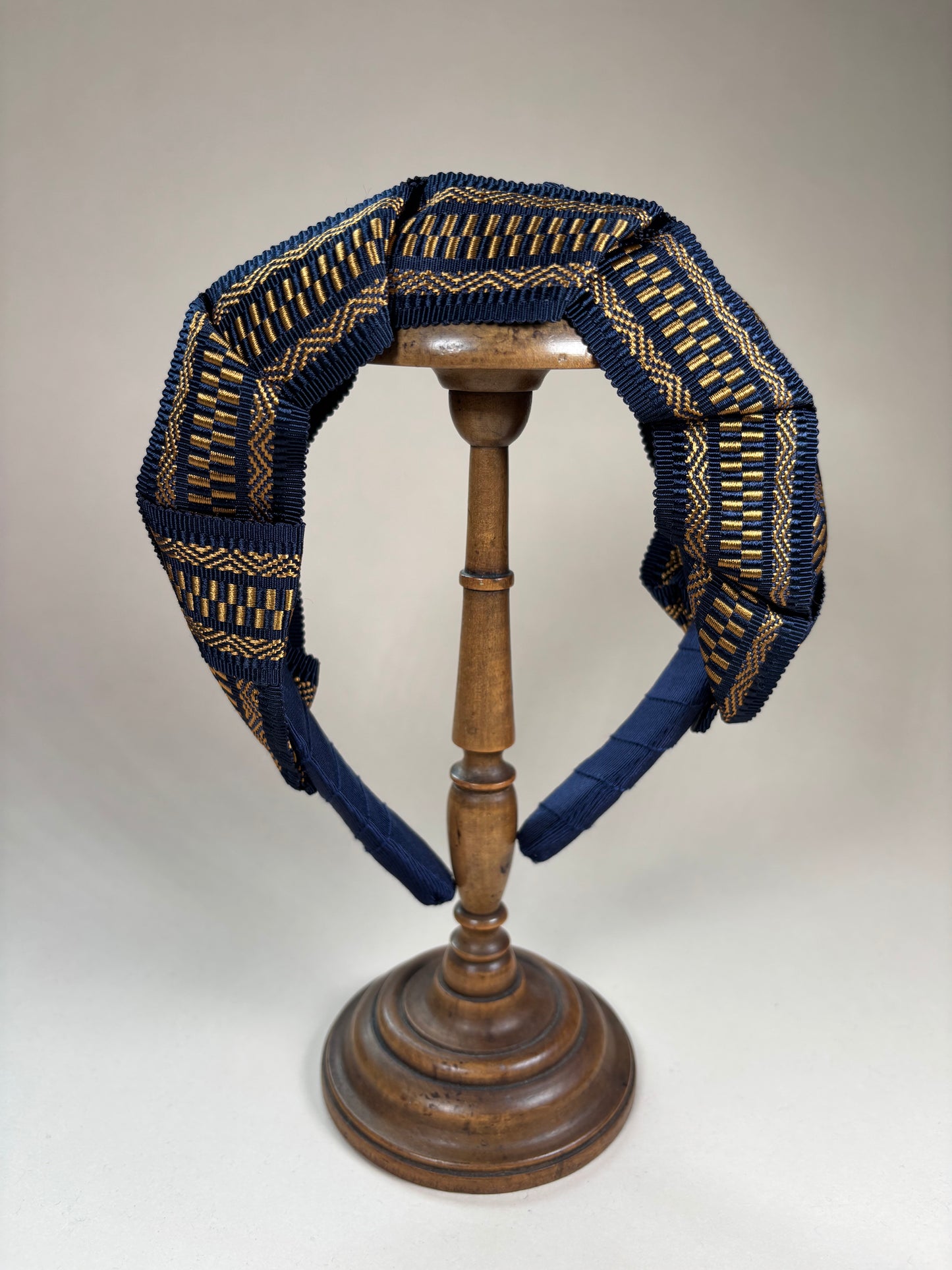 Mary in navy blue and gold