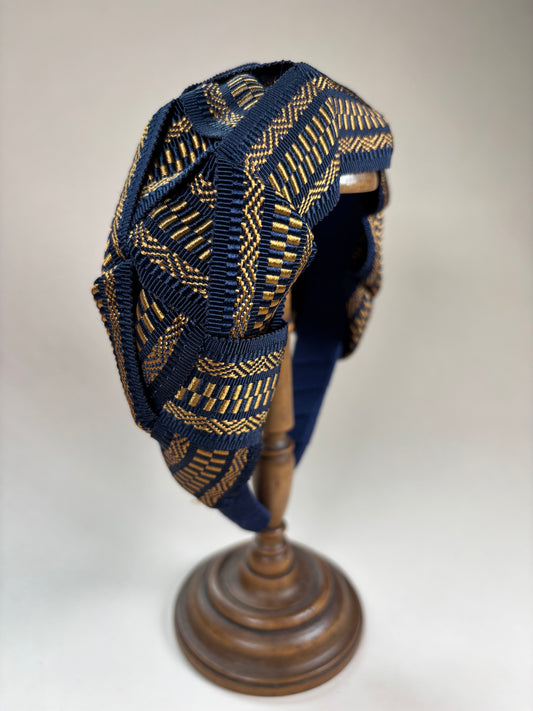 Mary in navy blue and gold